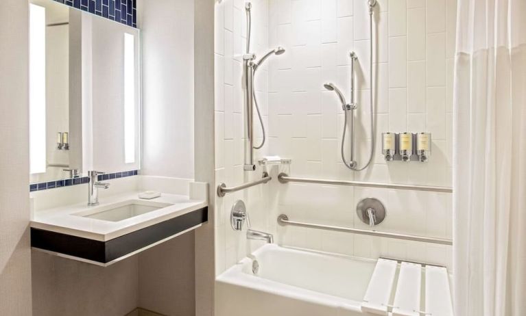 Private guest bathroom with combined shower and tub at Royal Sonesta Boston.