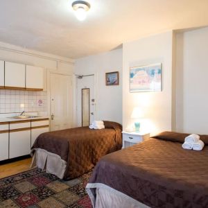Day use twin room with in-room kitchen and work desk at The Farrington Inn.