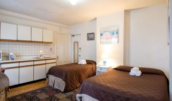 Day use twin room with in-room kitchen and work desk at The Farrington Inn.