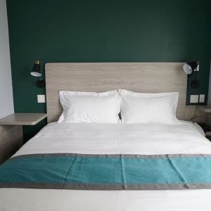 King bed at Starlight Hotel.
