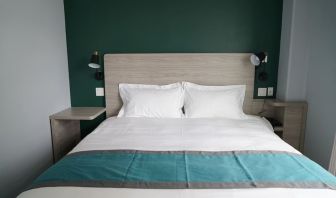 King bed at Starlight Hotel.