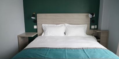 King bed at Starlight Hotel.