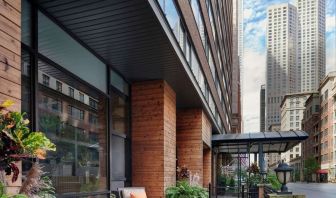 Hotel entrance and terrace with lounge seating at Sonesta ES Suites Chicago Downtown Magnificent Mile - Medical.