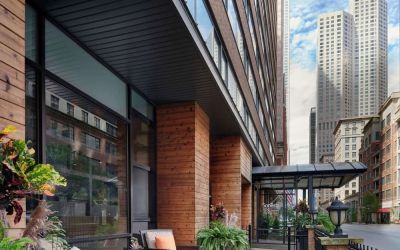 Hotel entrance and terrace with lounge seating at Sonesta ES Suites Chicago Downtown Magnificent Mile - Medical.