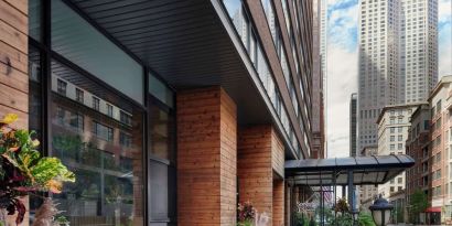 Hotel entrance and terrace with lounge seating at Sonesta ES Suites Chicago Downtown Magnificent Mile - Medical.