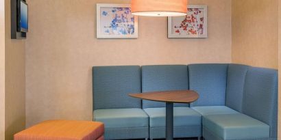 Lobby workspace with comfortable seating at Sonesta ES Suites Charlottesville University.