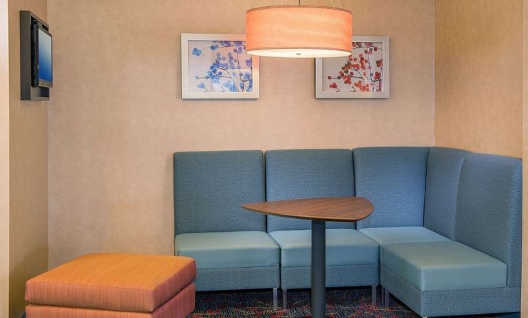 Lobby workspace with comfortable seating at Sonesta ES Suites Charlottesville University.