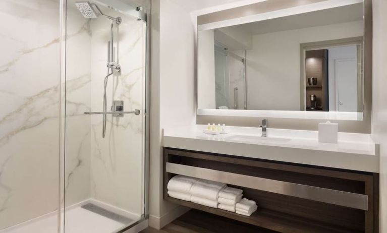 Private guest bathroom with shower and free toiletries at Royal Sonesta Kaua'i Resort Lihue.