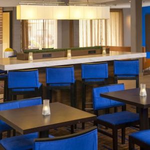 Dining area and workspace, perfect for coworking at Sonesta Select Charlotte University Research Park.