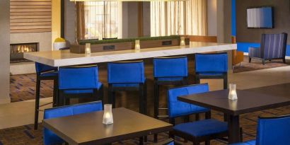 Dining area and workspace, perfect for coworking at Sonesta Select Charlotte University Research Park.