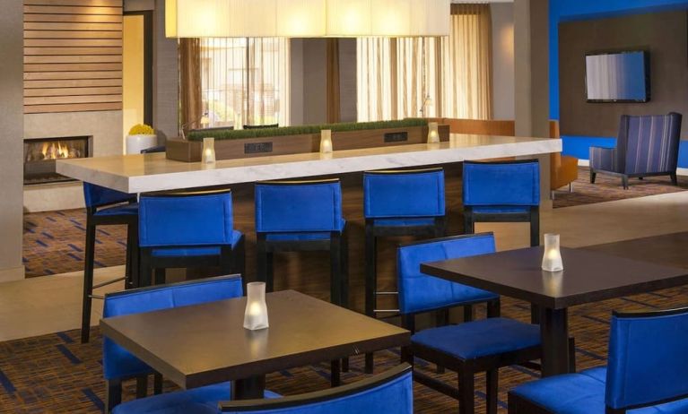 Dining area and workspace, perfect for coworking at Sonesta Select Charlotte University Research Park.