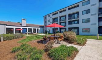 Patio and lounge seating at Sonesta Select Charlotte University Research Park.