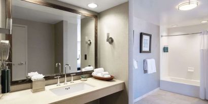Guest bathroom with shower and tub at Hilton San Francisco Financial District.