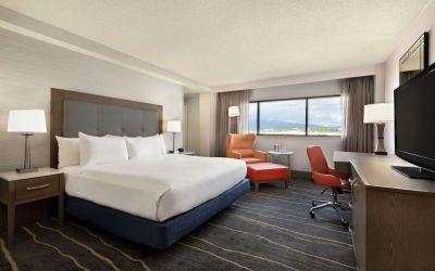 Comfortable king room with work desk and lounger at DoubleTree By Hilton Albuquerque.