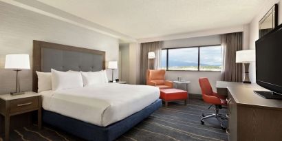 Comfortable king room with work desk and lounger at DoubleTree By Hilton Albuquerque.