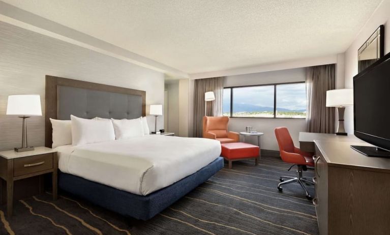 Comfortable king room with work desk and lounger at DoubleTree By Hilton Albuquerque.
