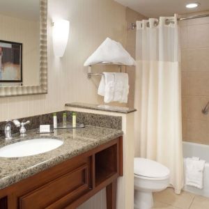 Guest bathroom with shower and tub at DoubleTree By Hilton Albuquerque.