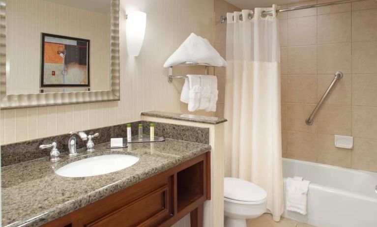 Guest bathroom with shower and tub at DoubleTree By Hilton Albuquerque.