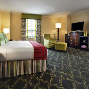 Spacious king suite with work desk and lounger at Palmer House A Hilton Hotel.