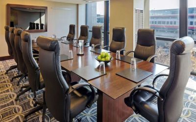 Bright-lit meeting room at Hilton Chicago O'Hare Airport.