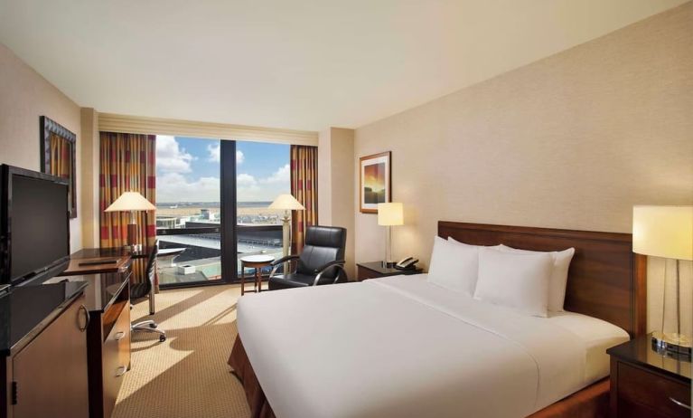Day use room with sound proofed windows and lounger at Hilton Chicago O'Hare Airport.