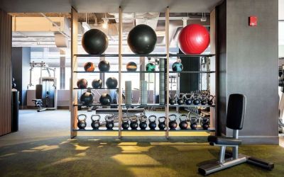 Fully equipped fitness center at Hilton Chicago O'Hare Airport.