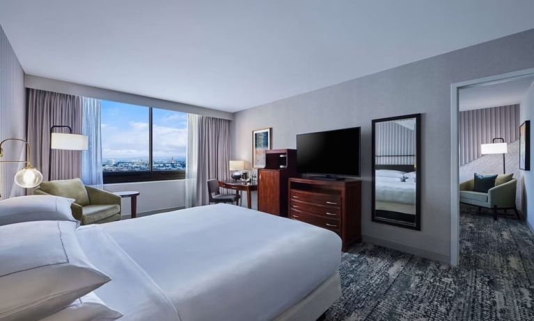 Day use room with work desk and living area at Hotel Fera Anaheim, A DoubleTree By Hilton.