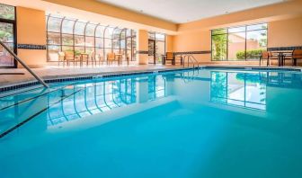 Indoor pool with lounge chairs at Sonesta Select Boston Milford.
