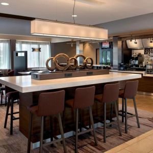 Dining area and workspace at Sonesta Select Boston Milford.