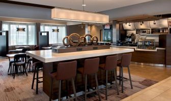 Dining area and workspace at Sonesta Select Boston Milford.