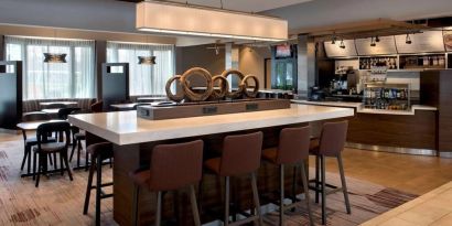 Dining area and workspace at Sonesta Select Boston Milford.