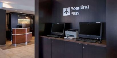 Business center with computers and printer at Sonesta Select Boston Milford.