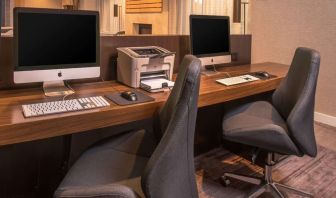 Business center with computers, printer and ergonomic chairs at Sonesta Select Arlington Rosslyn.