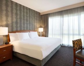 King suite with working station and natural light at Embassy Suites By Hilton Nashville South Cool Springs.