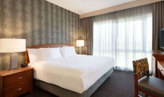 King suite with working station and natural light at Embassy Suites By Hilton Nashville South Cool Springs.