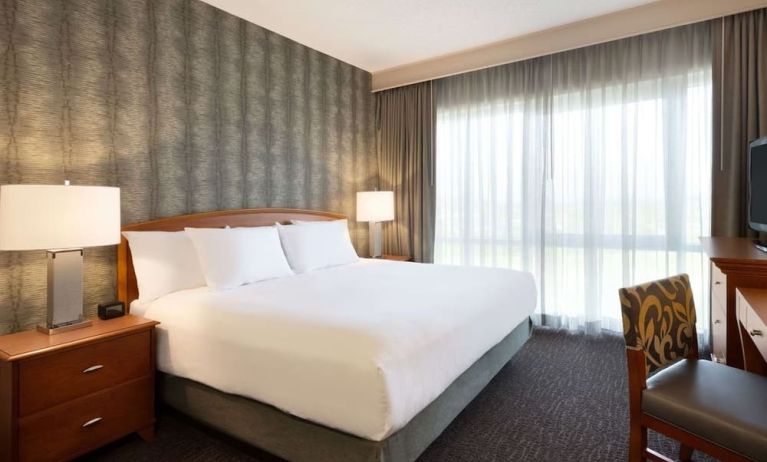 King suite with working station and natural light at Embassy Suites By Hilton Nashville South Cool Springs.