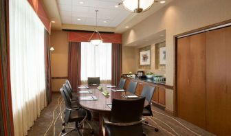 Bright-lit meeting room at Embassy Suites By Hilton Nashville South Cool Springs.