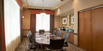 Bright-lit meeting room at Embassy Suites By Hilton Nashville South Cool Springs.