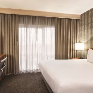 Day use room with work desk and natural light at Embassy Suites By Hilton Nashville South Cool Springs.