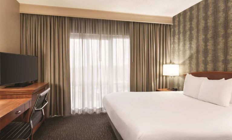 Day use room with work desk and natural light at Embassy Suites By Hilton Nashville South Cool Springs.