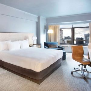 Day use room with work desk and natural light at New York Hilton Midtown.