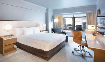 Day use room with work desk and natural light at New York Hilton Midtown.