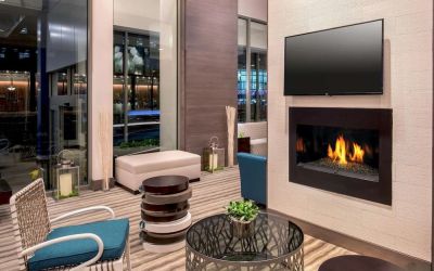 Comfortable lobby workspace by the fireplace at Hilton Garden Inn NYC Financial Center/Manhattan Downtown.
