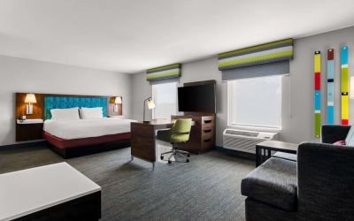 Spacious hotel suite with king size bed and working station at Hampton Inn & Suites Schererville.