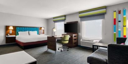 Spacious hotel suite with king size bed and working station at Hampton Inn & Suites Schererville.