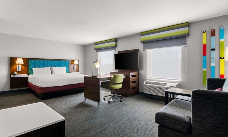 Spacious hotel suite with king size bed and working station at Hampton Inn & Suites Schererville.