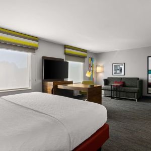 Spacious hotel suite with king size bed and working station at Hampton Inn & Suites Schererville.