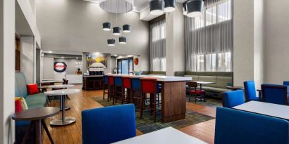 Lobby and coworking lounge at Hampton Inn & Suites Schererville.