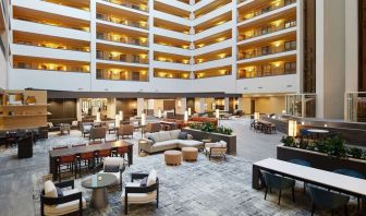 Spacious lobby and coworking lounge at Hilton Charlotte Airport.
