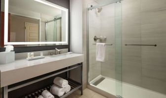 Guest bathroom with shower at Hilton Charlotte Airport.
